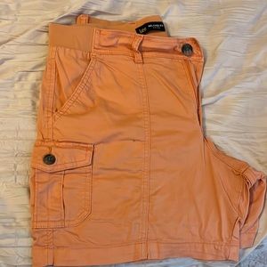 Salmon color shorts with button side pockets